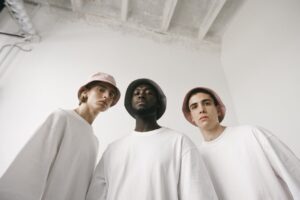 Low-Angle Shot of Men in White Shirt Wearing Bucket Hats